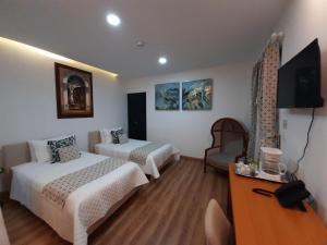 Postel nebo postele na pokoji v ubytování Adamas House Hotel Boutique