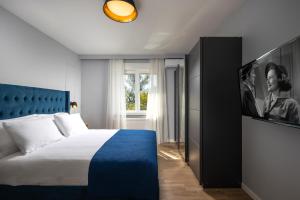 Postel nebo postele na pokoji v ubytování Blue Allure Apartment
