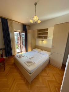 Postel nebo postele na pokoji v ubytování Apartmani Dragica