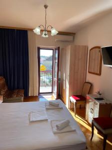 Postel nebo postele na pokoji v ubytování Apartmani Dragica