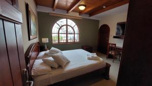 Postel nebo postele na pokoji v ubytování Hotel Voyager Manta