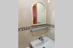 a bathroom with a sink and a mirror at Berlin Lovely in Gran Tarajal +59 photos