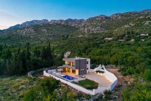 an aerial view of a house in the mountains at Royal Promons in Starigrad-Paklenica