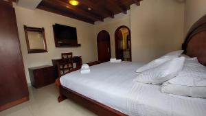 Voodi või voodid majutusasutuse Hotel Voyager Manta toas
