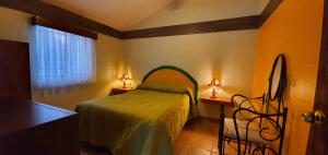 En eller flere senge i et værelse på Parque Girasoles Balneario & Cabañas + 122 billeder