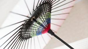 a colorful umbrella hanging from a ceiling at Kyoto Inn Gion The Second in Kyoto