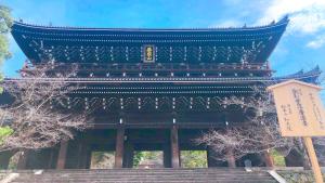 a large building with stairs in front of it at Kyoto Inn Gion The Second in Kyoto