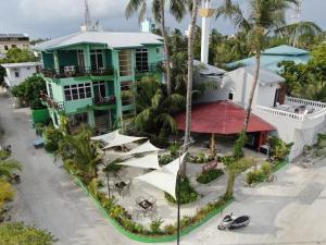 an aerial view of a house on the beach at Oceana Boutique in Maafushi