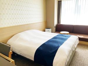 Postel nebo postele na pokoji v ubytování Hotel Abest Grande Takatsuki