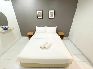 Postel nebo postele na pokoji v ubytování 1108 Hotel Sungkai