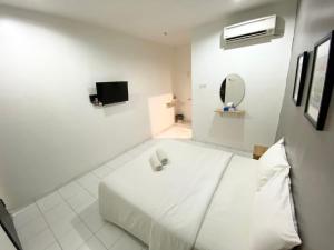 Postel nebo postele na pokoji v ubytování 1108 Hotel Sungkai