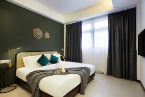 A bed or beds in a room at The Initial Residence