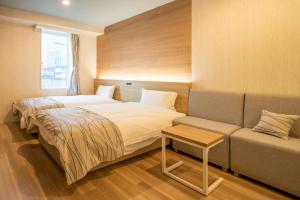 Katil atau katil-katil dalam bilik di HOTEL AMANEK Asahikawa