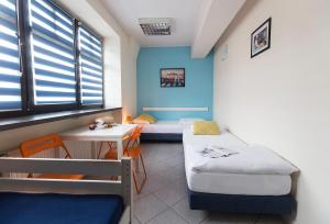 Posteľ alebo postele v izbe v ubytovaní Hello Hostel & Apartments