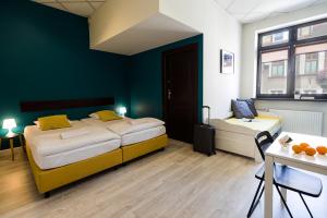 Posteľ alebo postele v izbe v ubytovaní Hello Hostel & Apartments