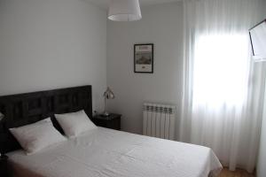 Posteľ alebo postele v izbe v ubytovaní Apartaments Centre Figueres