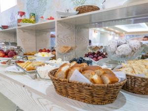 a buffet with baskets of bread and other food at Grand Vizir Hotel in Khiva