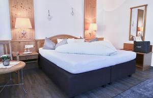 A bed or beds in a room at Stacklerhof