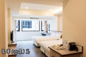 Postel nebo postele na pokoji v ubytování Shang Shan Ting Chao Hotel