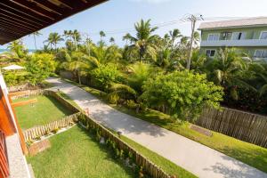 an aerial view of a garden with palm trees at Residencial Ykutiba- Imbassaì Ap A-103 in Imbassai