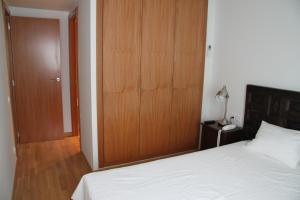 Posteľ alebo postele v izbe v ubytovaní Apartaments Centre Figueres