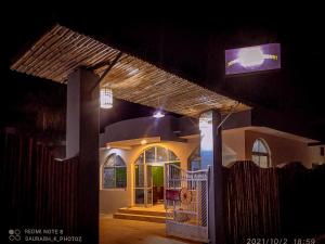 a house with a tv on top of it at night at Hotel Jungle Palace Resort in Umariā