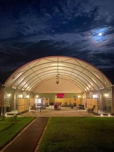 a large building with a moon in the sky at Lake Tyrrell Accommodation LTA in Sea Lake