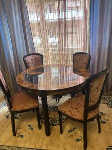 a wooden table with two chairs and a wooden table with at Bed and Breakfast Impruneta28 in Rome