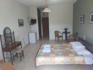 Postel nebo postele na pokoji v ubytování Miaritis rooms