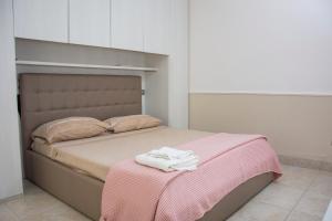 En eller flere senge i et værelse på B&B Domus del Sole