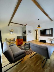 a living room with a couch and a table at Mia's Favorite Hotel in Mavrovo