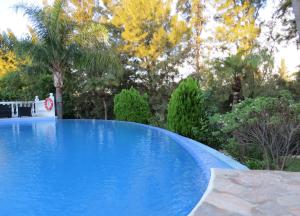 Bazén v ubytovaní Spacious 700m2 villa, Golfers paradise. alebo v jeho blízkosti