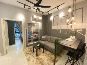 a living room with a couch and a table at 1BR ARTE Mont Kiara WIFI in Kuala Lumpur