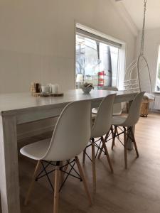 a dining room with a table and chairs at Country house between Egmond aan Zee & Amsterdam in Castricum