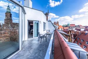 a balcony with a view of the city at Aparthotel New Lux in Wrocław