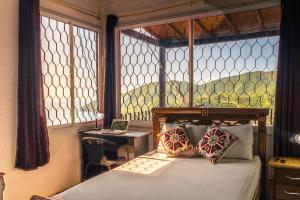 Ένα ή περισσότερα κρεβάτια σε δωμάτιο στο Casa Blanca - Taganga