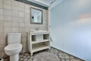 a bathroom with a toilet and a sink at Chateau La Vallette - Grand Master's Suite in Valletta