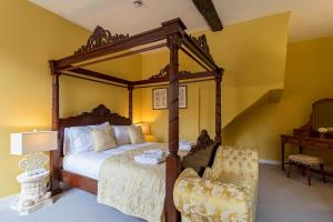 A bed or beds in a room at The Black Lion Hotel 