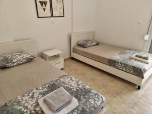 Posteľ alebo postele v izbe v ubytovaní Lucas2 Lux Flogita apartment