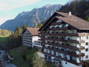 an aerial view of a hotel with mountains in the background at Alpenblick Suite in Bad Goisern