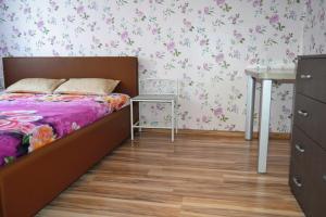 a small bedroom with a bed and a desk at Imanta Apartment Riga 2х Rooms 52м2 in Rīga