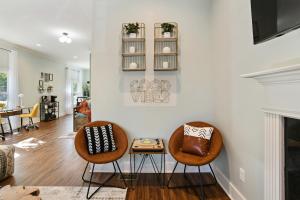 two chairs and a table in a living room at SUN LIT MODERN HOME with GOOD VIBES AND LOTS OF COFFEE - DesignedByDom in Atlanta