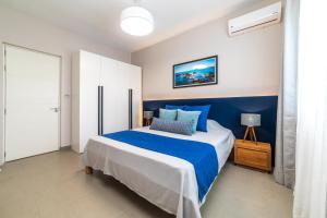 Un pat sau paturi într-o cameră la One Bay Residence - Apartment 12 - Apartment in Pereybere +26 fotografii