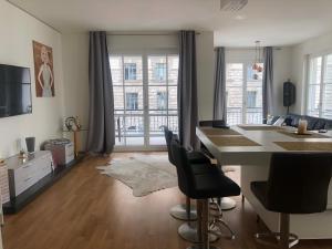 a kitchen with a table and chairs in a room at Luxury 145 m2 Apartment with Terrace in Berlin