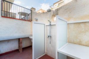 a bathroom with a shower and a toilet and a sink at La Maiolica in Noto Marina