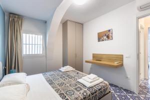 מיטה או מיטות בחדר ב-La Maiolica