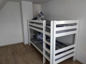 a white bunk bed in a room at Gasthaus Bikertreff in Gablingen +1 photo