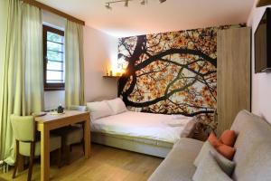 Postel nebo postele na pokoji v ubytování Apartments Sport House Novakovic