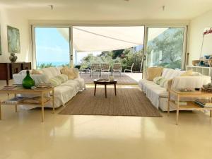 A seating area at Stunning Design Villa with unique 180º sea views