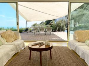 A seating area at Stunning Design Villa with unique 180º sea views